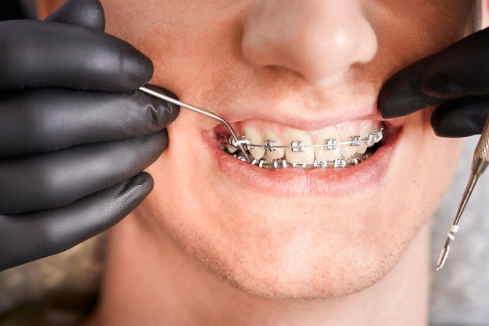 male pediatrician doing vaccination to baby boy with a syringe in the hospital
